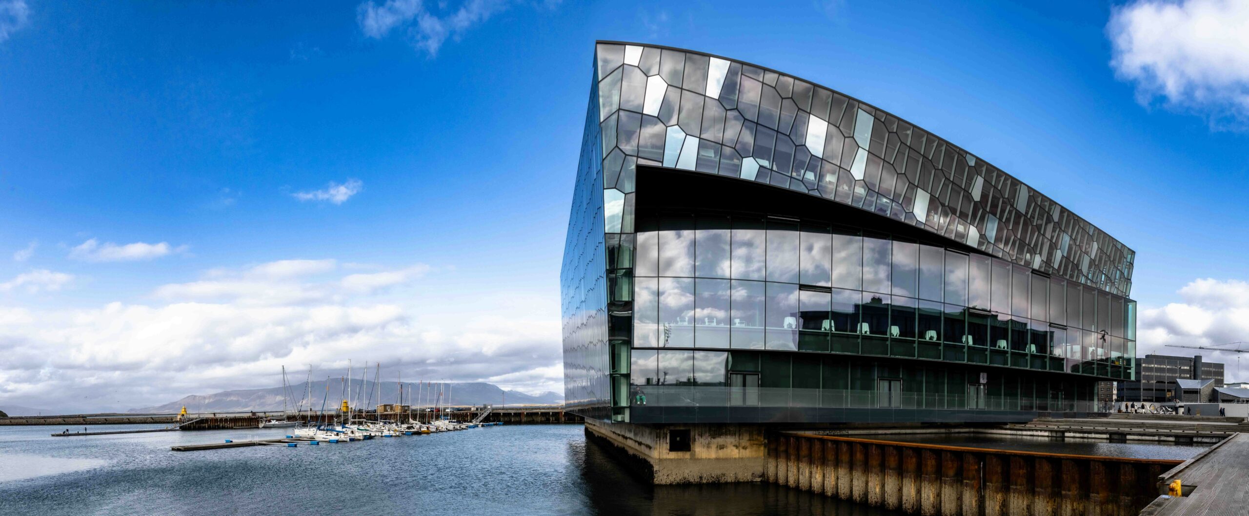 a large building sitting next to a body of water